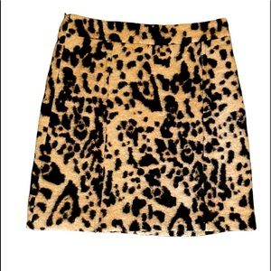 Fuzzy, animal print A-line mini skirt.